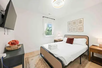 a bedroom with a bed and a desk and a window at 4BR, 2 & half Bath, Hot Tub, Private Parking, Near Ark in Dry Ridge