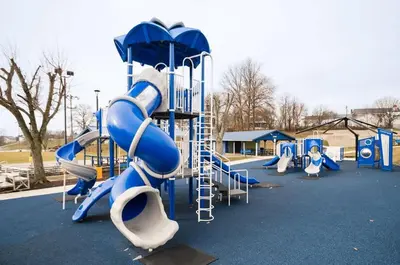 a playground with a slide in a park at 3-story home for 12 Near Ark with Hot Tub & Parking! in Dry Ridge