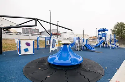 a blue vase on a table in a playground at 3-story home for 12 Near Ark with Hot Tub & Parking! in Dry Ridge