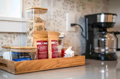 a wooden tray filled with food on top of a counter at 3-story home for 12 Near Ark with Hot Tub & Parking! in Dry Ridge