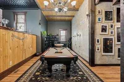 a room with a ping pong table in it at School of Sorcery in Brinkhaven