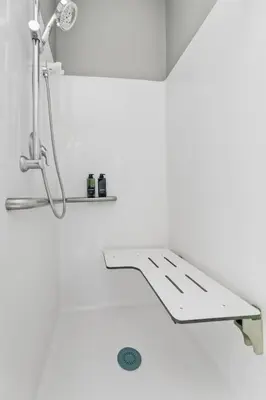 a bathroom with a shower and a sink at 1BR Retreat, 2 Smart TVs, WiFi & Free Parking in Cleveland