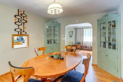 a dining room with a wooden table and chairs at Less Than 1 Mi to Dtwn Tiffin Home with Outdoor Space! in Tiffin
