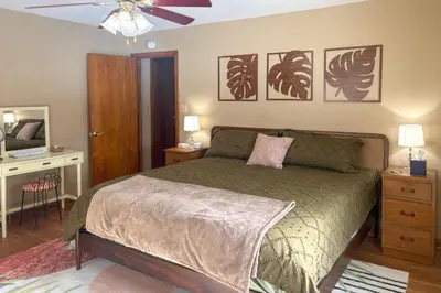 a bedroom with a bed and a ceiling fan at Less Than 1 Mi to Dtwn Tiffin Home with Outdoor Space! in Tiffin