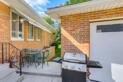 a patio with a stove and a table and chairs at Less Than 1 Mi to Dtwn Tiffin Home with Outdoor Space! in Tiffin