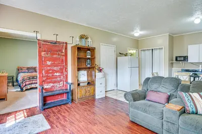 a living room with a couch and a chair at 4 Mi to Ohio River Quiet Guest House with Yard!