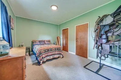 a bedroom with a bed and a dresser in it at 4 Mi to Ohio River Quiet Guest House with Yard!