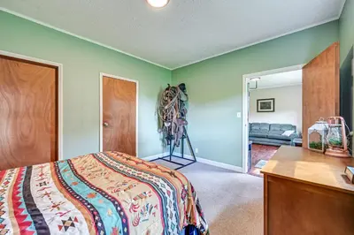 a bedroom with a bed and a room with a couch at 4 Mi to Ohio River Quiet Guest House with Yard!