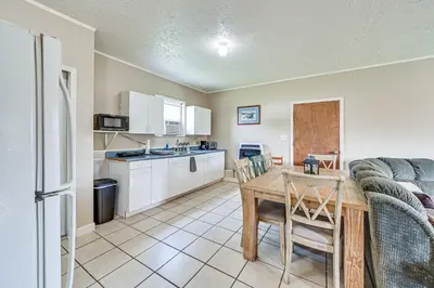 a kitchen and living room with a table and a couch at 4 Mi to Ohio River Quiet Guest House with Yard!