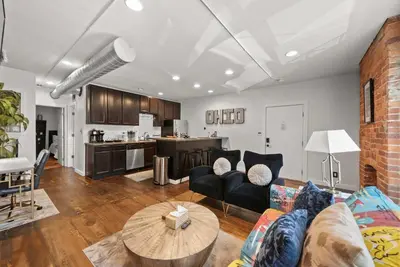 a living room with a couch and a table at Short North Lounge - Stay for 2 in Columbus