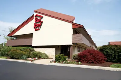 a building with a sign on the side of it at Red Roof Inn Parkersburg in Parkersburg