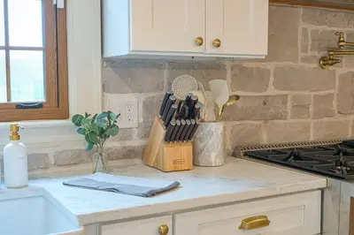 a kitchen counter with a knife block on it at Bellawood Farmhouse in Canal Winchester