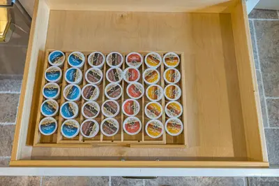 a display ofcolored plates in a wooden box at Bellawood Farmhouse in Canal Winchester