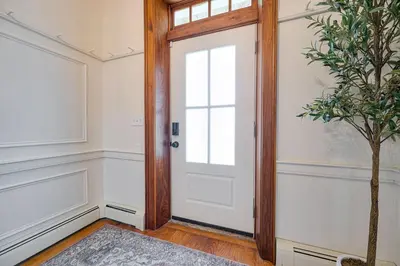 an empty room with a door and a plant at Bellawood Farmhouse in Canal Winchester