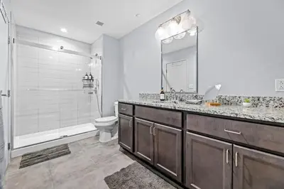 a bathroom with a sink and a toilet and a shower at King Bed Comfort, Bidet, Fast Wi-Fi, Parking in Cleveland