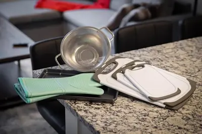 a table with a strainer and a pot on it at King Bed Comfort, Bidet, Fast Wi-Fi, Parking in Cleveland