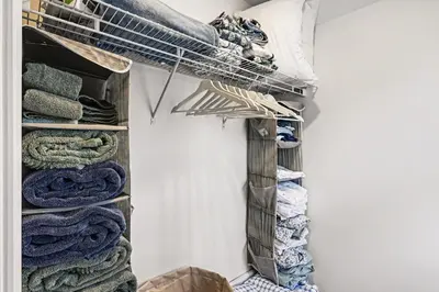 a walk in closet filled with lots of towels at Cozy Campbell Bungalow in Columbus