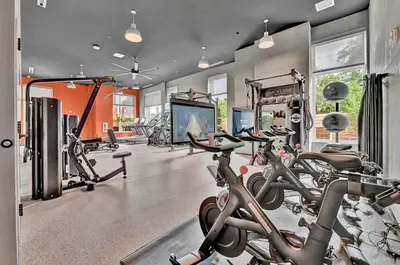 a gym with several treadmills and cardio machines at Stay in Cleveland mins to Cleveland Clinic, Hospitals, Museum, Universities & Downtown in Cleveland