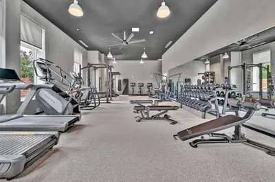 a gym with a lot of treadmills and machines at Stay in Cleveland mins to Cleveland Clinic, Hospitals, Museum, Universities & Downtown in Cleveland