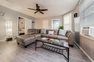 a living room with a couch and a table at Just Like Home in Cleveland