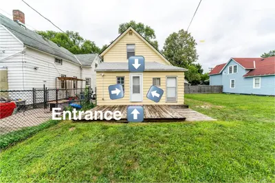 a house with an entrance sign in front of it at Just Like Home in Cleveland