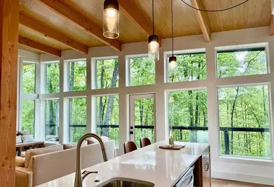 a kitchen with a large group of windows at The Briar House in McArthur