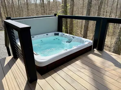 a hot tub sitting on a wooden deck at The Briar House in McArthur