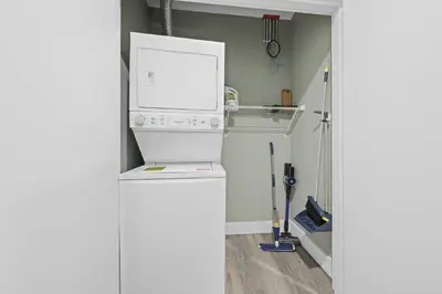 a kitchen with a dishwashing machine in a room at 1BR • City Views • Queen + SofaBed • WiFi & 2 TVs in Cleveland