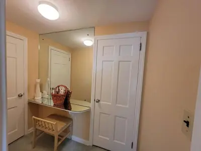 a bathroom with a mirror and a white door at Your Home Away from Home Sleeps 12 Fully Equipped in Youngstown