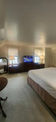 a bedroom with a bed and a flat screen tv at Your Home Away from Home Sleeps 12 Fully Equipped in Youngstown