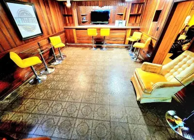 a living room with a couch and chairs at Your Home Away from Home Sleeps 12 Fully Equipped in Youngstown
