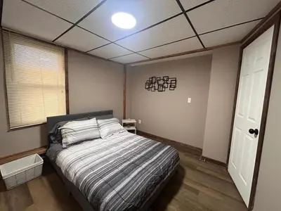 a bedroom with a bed and a ceiling at A gem in the heart of Cleveland Unit 3 in Cleveland