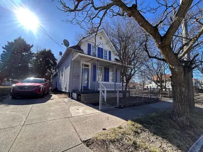 a house with a car parked in front of it at A gem in the heart of Cleveland Unit 3 in Cleveland