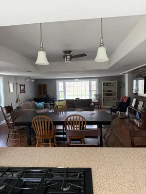 a living room with a table and a couch at Old Orchard Kirtland, Ohio