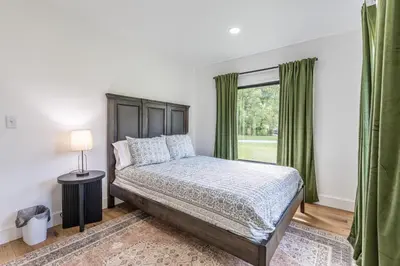 a bedroom with a bed and a window at Ravenwood in Killbuck