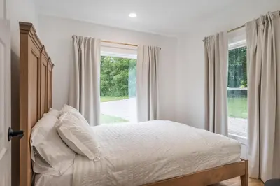 a bedroom with a bed and a window at Swancrest in Killbuck