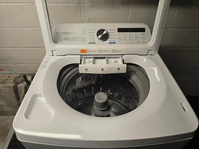 a white washing machine with its door open at Townhouse at 99 in Boardman