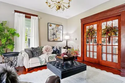a living room with a couch and a table at The Victorian House in Canfield