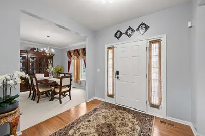 a dining room and living room with a table and chairs at Pickerington Haven - Home for 10 in Pickerington