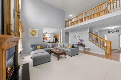 a living room with a couch and a fireplace at Pickerington Haven - Home for 10 in Pickerington