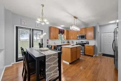 a kitchen with a island in the middle of it at Pickerington Haven - Home for 10 in Pickerington