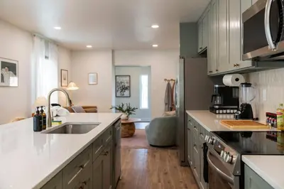 a kitchen with a sink and a counter at Stunning 2 BR - Parking and Walk to Park in Columbus