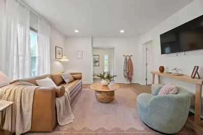 a living room with a couch and a table at Stunning 2 BR - Parking and Walk to Park in Columbus
