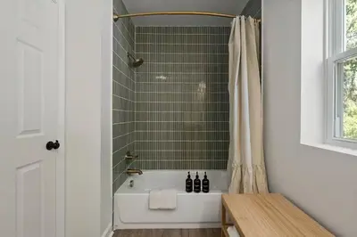 a bathroom with a tub and a shower at Stunning 2 BR - Parking and Walk to Park in Columbus
