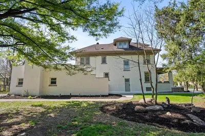 an old white house with a tree in the yard at Stunning 2 BR - Parking and Walk to Park in Columbus