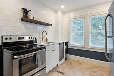 a kitchen with a stove and a sink at Close to OSU Rooftop Patio Grill & Outdoor TV in Columbus