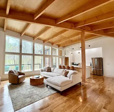 a living room with a couch and a table at The Hollow House in McArthur