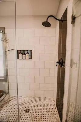 a bathroom with a shower with a glass door at The Honey Hut Think of On Golden Pond in Mount Sterling