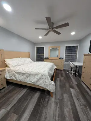 a bedroom with a bed and a ceiling fan at CulDeSec Home 4BR 3 & half Baths Sleeps 7 Jacuzzi tub in Columbus