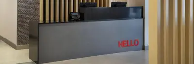 a reception desk with a halo sign on it at TownePlace Suites by Marriott Youngstown North in Girard
